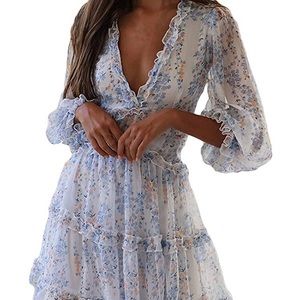 Long sleeve ruffle layer backless swing dress.